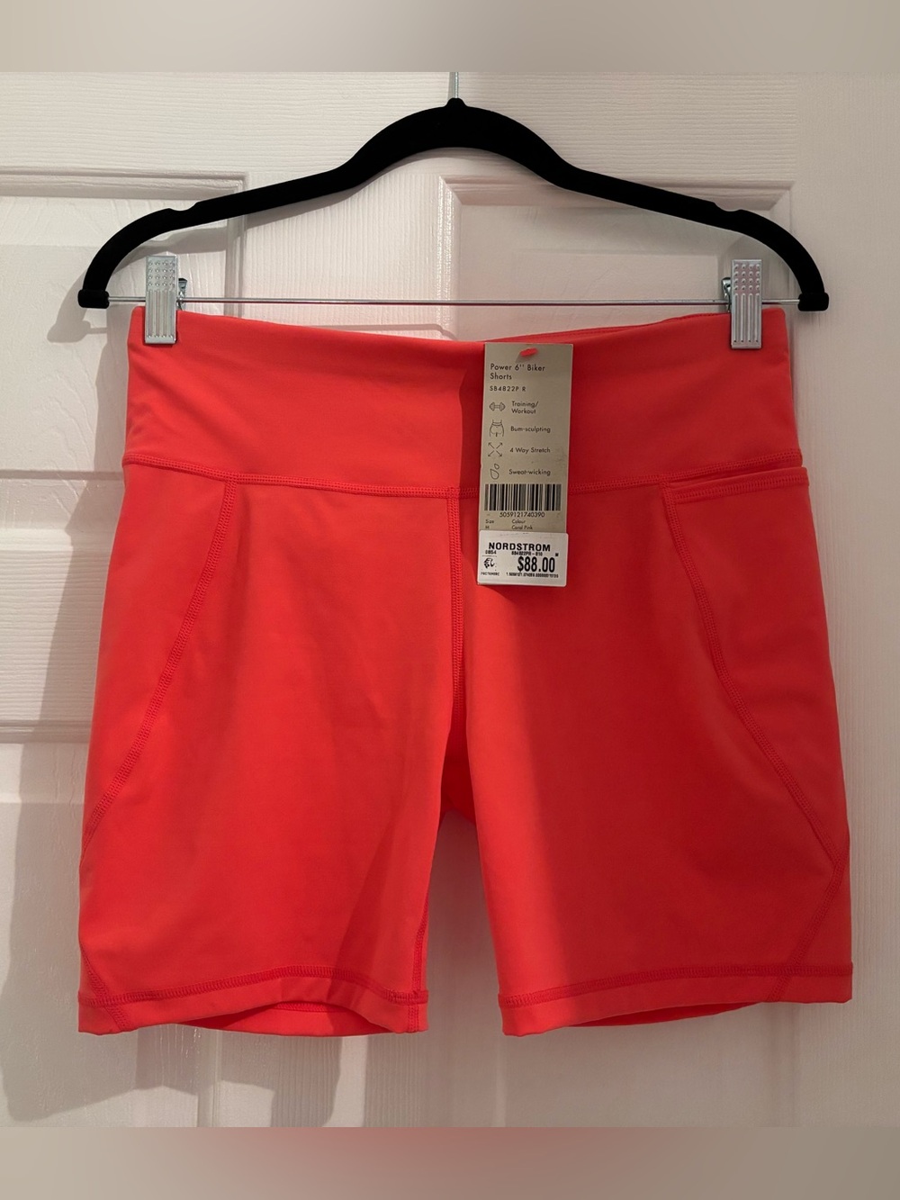 NWT Sweaty Betty orange bike shorts with phone pocket! $88 at Nordstroms. Medium